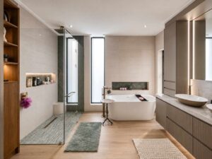 Main bathroom at House 671 with a freestanding bath, double vanity and walk-in shower
